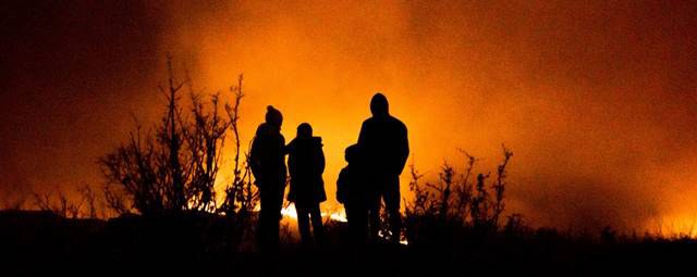 Figure 1 Family watching a wildfire in the distance, summer of 2020 [1].jpg